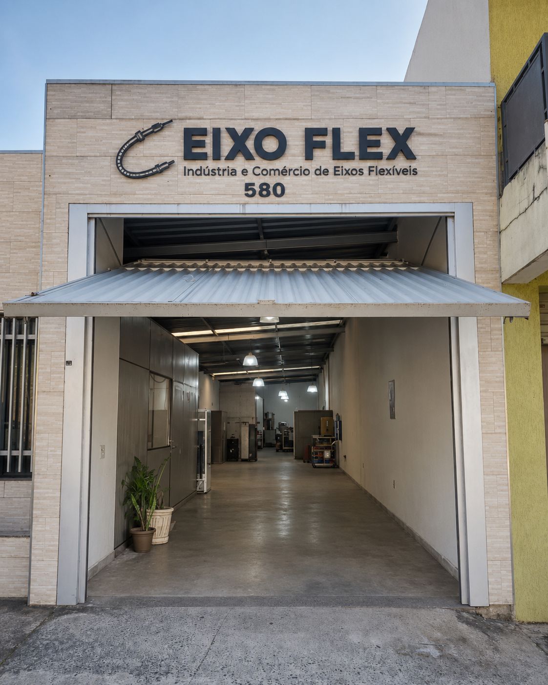 Fachada da Eixo Flex, com letreiro EIXO FLEX — Indústria e Comércio de Eixos Flexíveis, número 580
